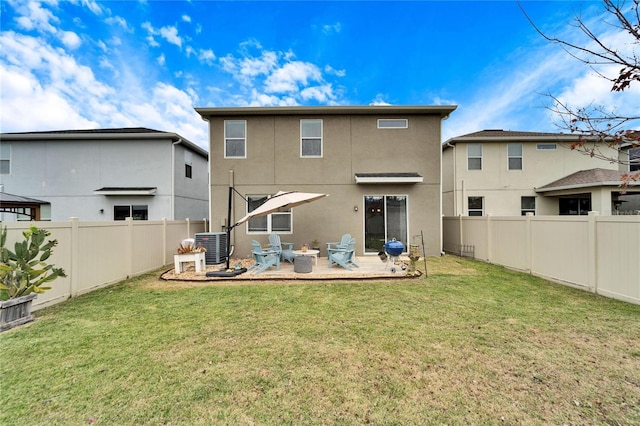 back of property featuring a yard, a patio, and central AC unit