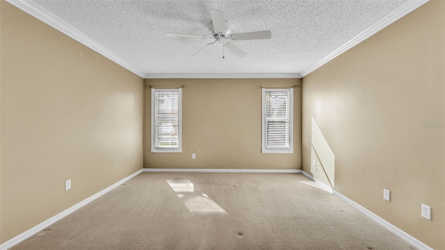 empty room featuring plenty of natural light, ornamental molding, and light carpet