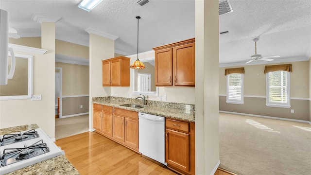 kitchen featuring a textured ceiling, white dishwasher, ceiling fan, and crown molding