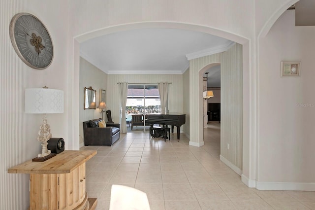 hall featuring crown molding and light tile patterned floors