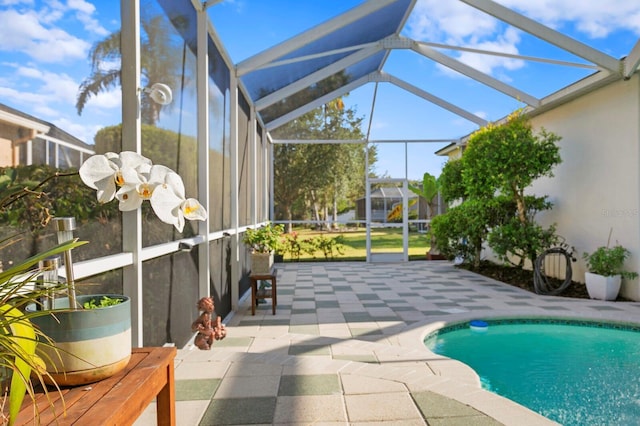 view of pool with a lanai and a patio area