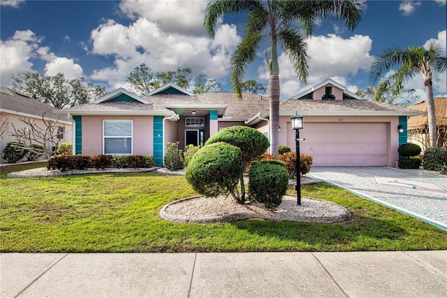 single story home featuring a front yard and a garage