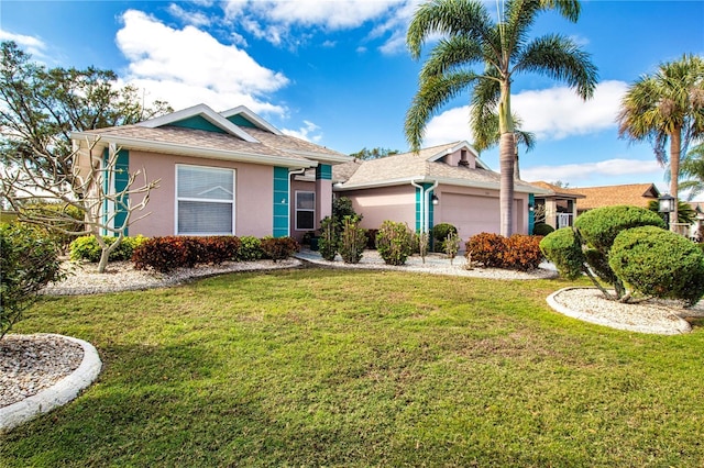 ranch-style home with a garage and a front yard