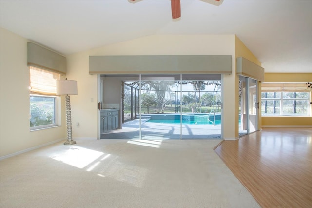 view of swimming pool featuring ceiling fan