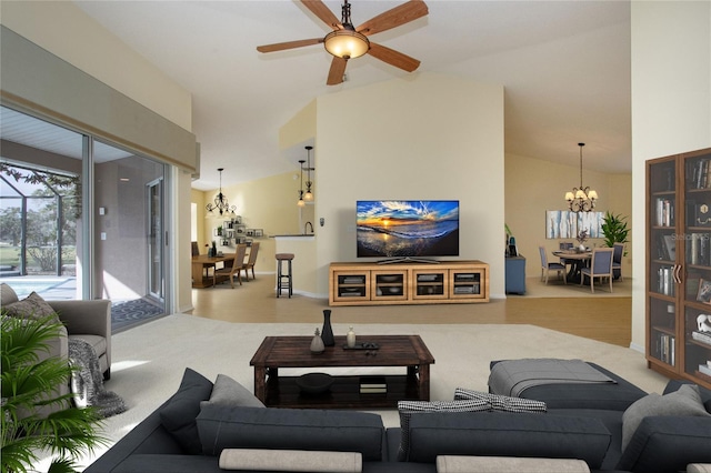 carpeted living room featuring lofted ceiling and ceiling fan with notable chandelier