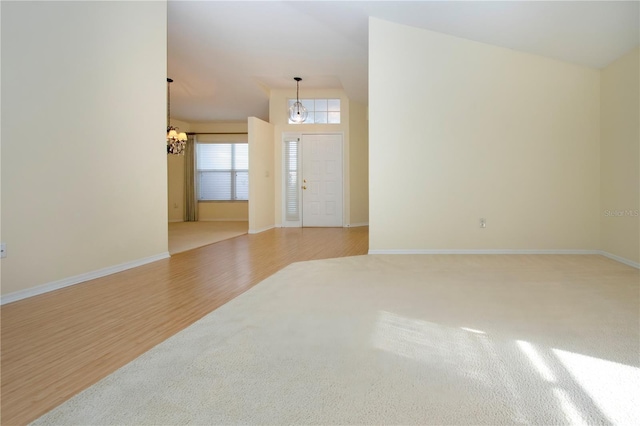 entrance foyer featuring a chandelier and light wood-type flooring