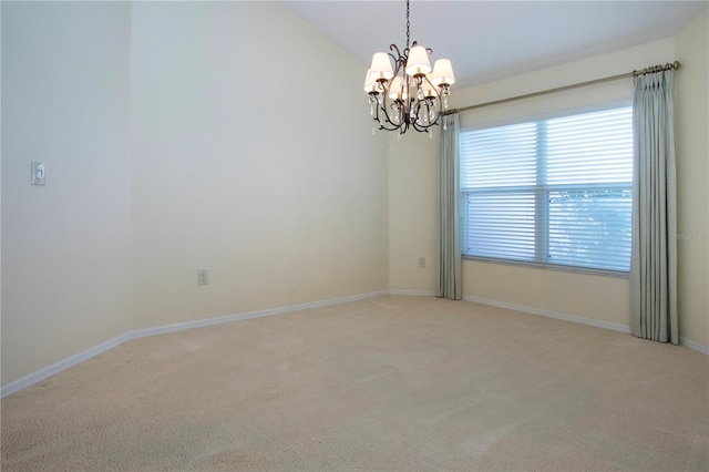 empty room featuring light carpet, vaulted ceiling, and an inviting chandelier