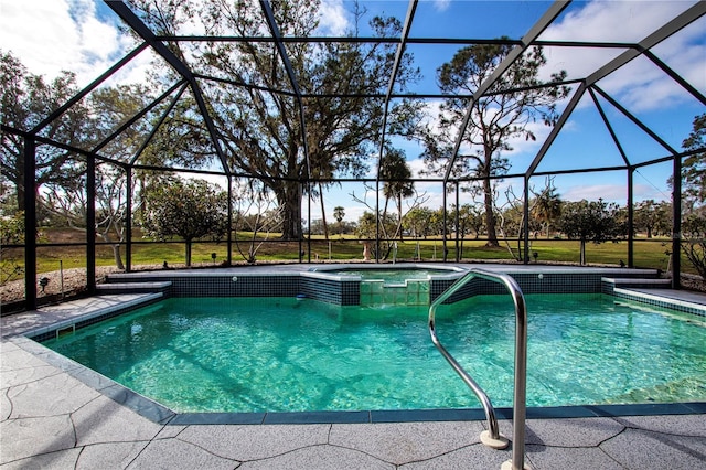 view of swimming pool with an in ground hot tub and a lanai