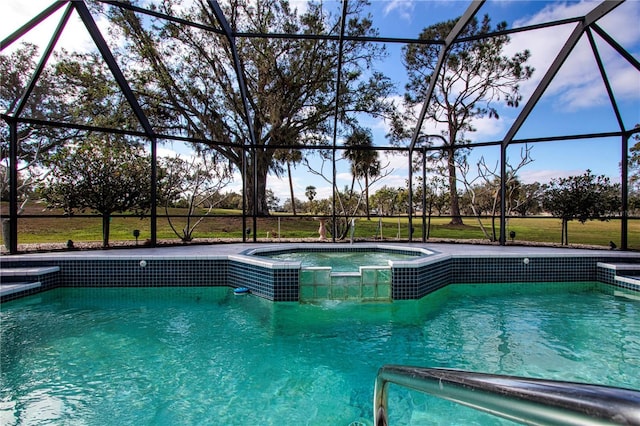 view of swimming pool featuring a lanai and an in ground hot tub