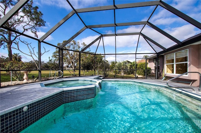 view of swimming pool featuring a lanai, pool water feature, and an in ground hot tub