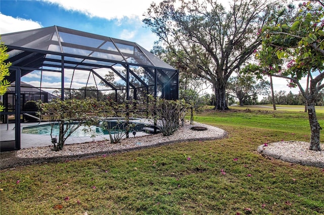 view of yard featuring glass enclosure