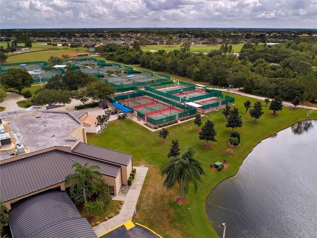 birds eye view of property with a water view