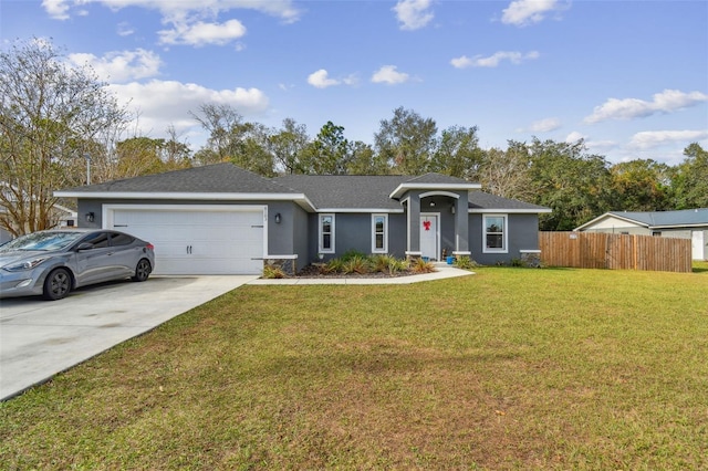 single story home featuring a front lawn and a garage