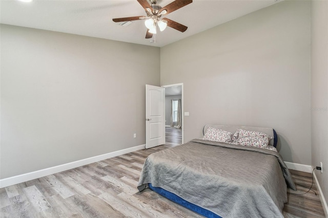 bedroom with ceiling fan and light hardwood / wood-style floors