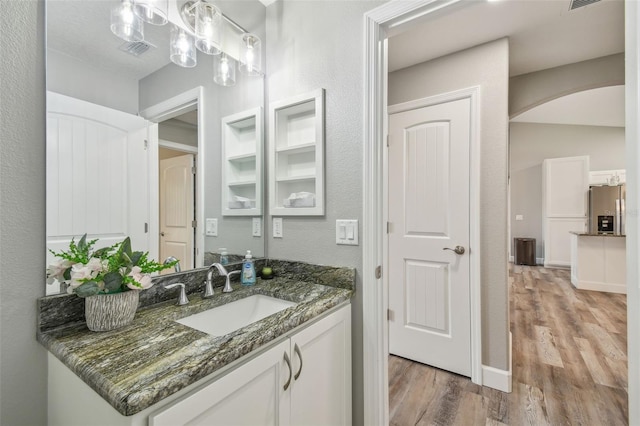 bathroom featuring hardwood / wood-style floors and vanity