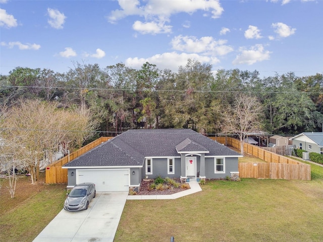 ranch-style home with a front yard and a garage