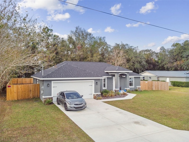 ranch-style house featuring a front yard and a garage