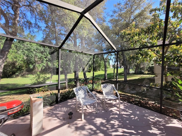 view of patio / terrace with a lanai