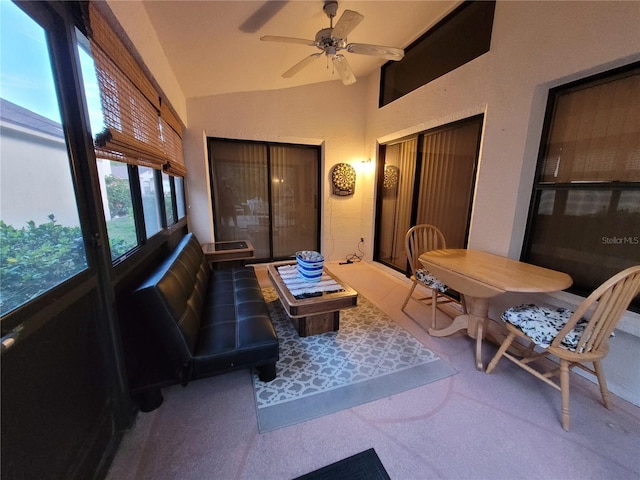 sunroom / solarium featuring ceiling fan and vaulted ceiling