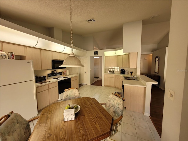 kitchen featuring light brown cabinetry, white appliances, sink, light tile patterned floors, and high vaulted ceiling