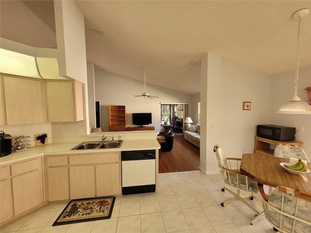 kitchen featuring light brown cabinetry, white dishwasher, vaulted ceiling, sink, and light tile patterned floors