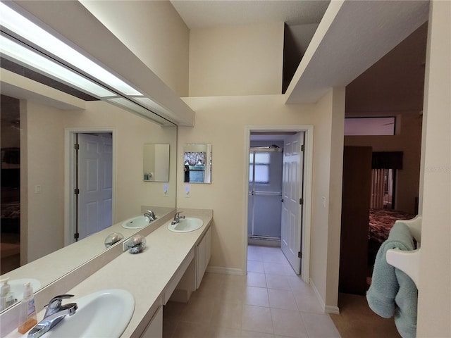 bathroom with tile patterned flooring and vanity