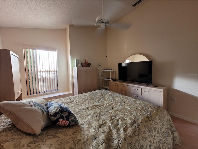 carpeted bedroom featuring ceiling fan, lofted ceiling, and a textured ceiling