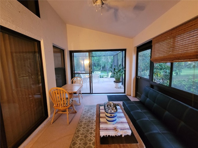 sunroom with ceiling fan and lofted ceiling