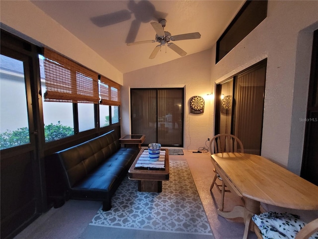 interior space featuring ceiling fan and lofted ceiling