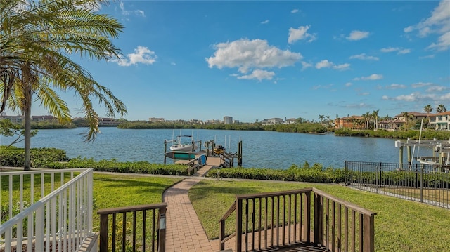 exterior space with a lawn and a water view