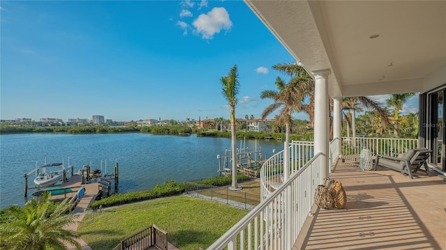 balcony with a dock and a water view