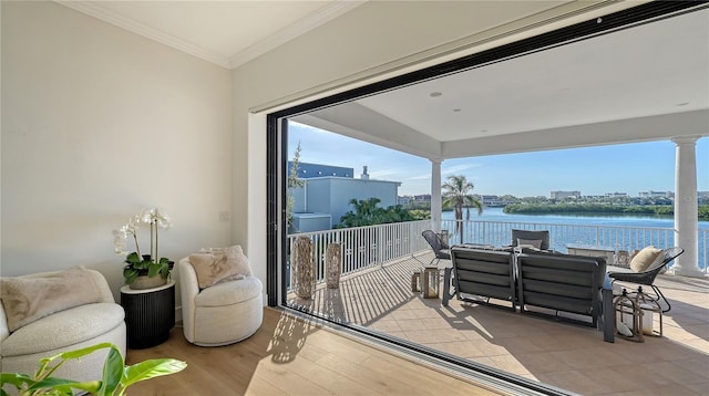 balcony featuring a water view