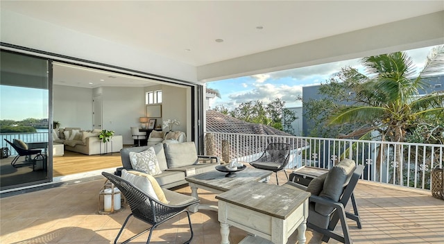 view of patio / terrace with an outdoor living space and a water view