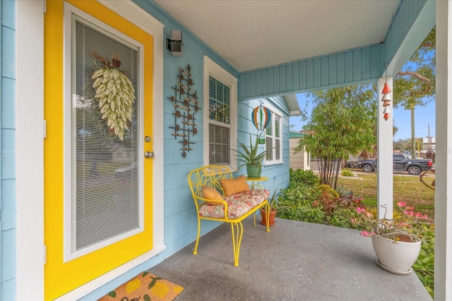 view of exterior entry with a porch