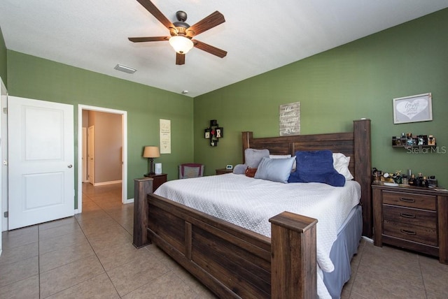 bedroom with ceiling fan and light tile patterned floors