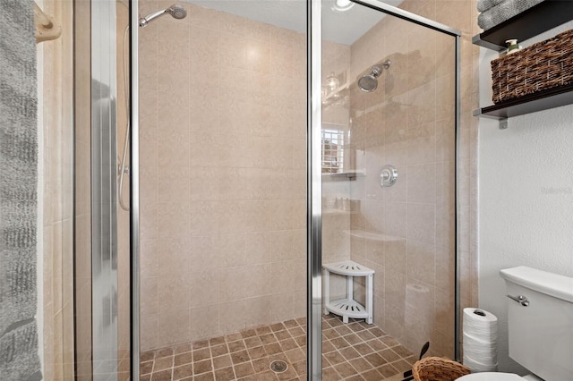 bathroom with walk in shower and toilet