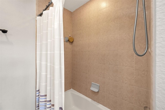 bathroom featuring shower / tub combo with curtain