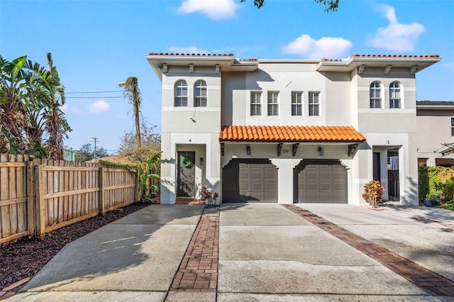 mediterranean / spanish house with a garage