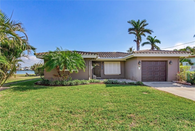 view of front of house featuring a garage and a front yard