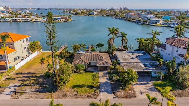 birds eye view of property with a water view