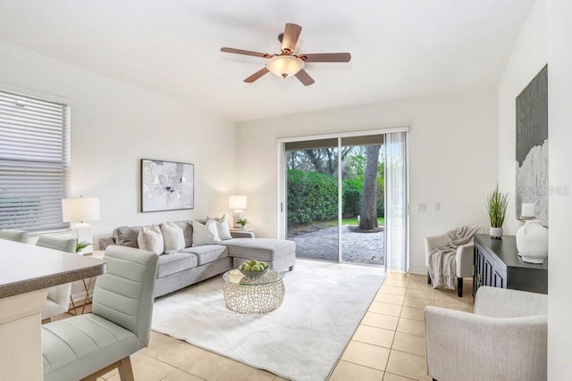 tiled living room featuring ceiling fan