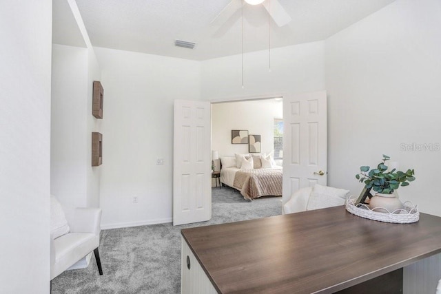 carpeted bedroom with ceiling fan