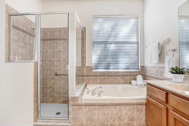 bathroom with vanity and plus walk in shower