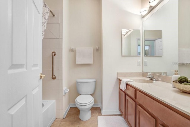 full bathroom with tile patterned flooring, vanity, toilet, and tiled shower / bath