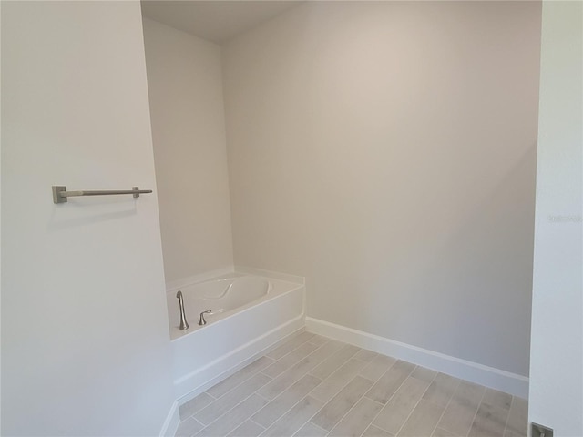 bathroom featuring a tub to relax in