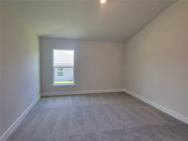 unfurnished room with carpet floors