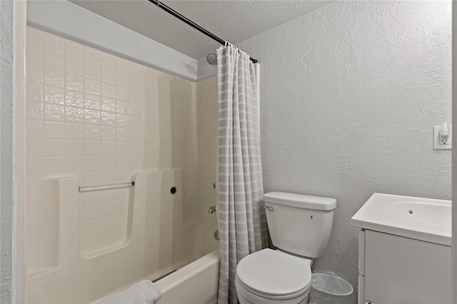 full bathroom featuring toilet, shower / tub combo, vanity, and a textured ceiling