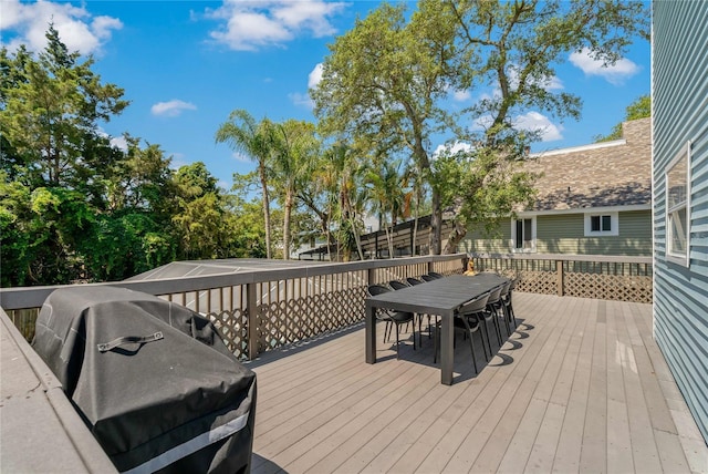 wooden terrace with area for grilling