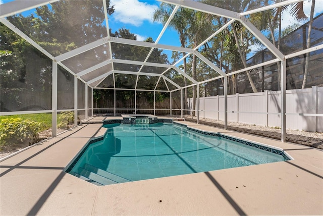 view of pool with a lanai and a patio