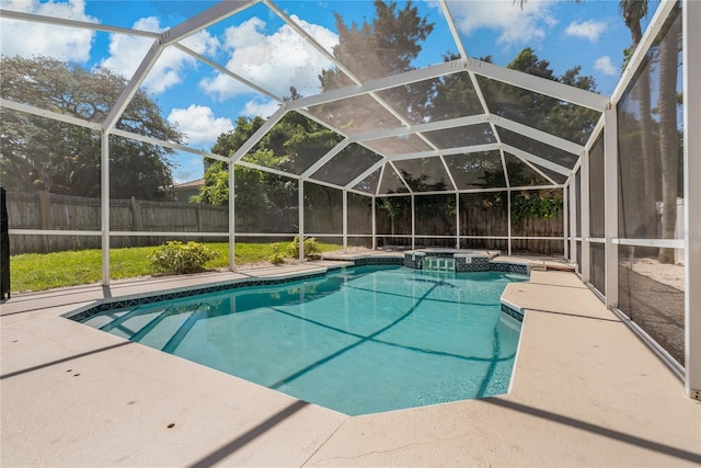 view of swimming pool featuring a lanai and a patio area